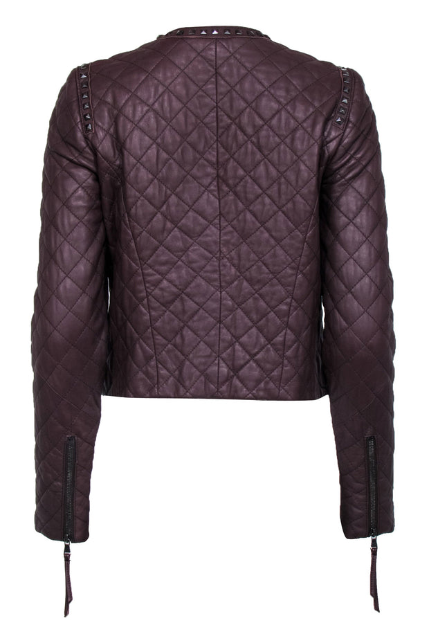 Leather jacket with quilted trims