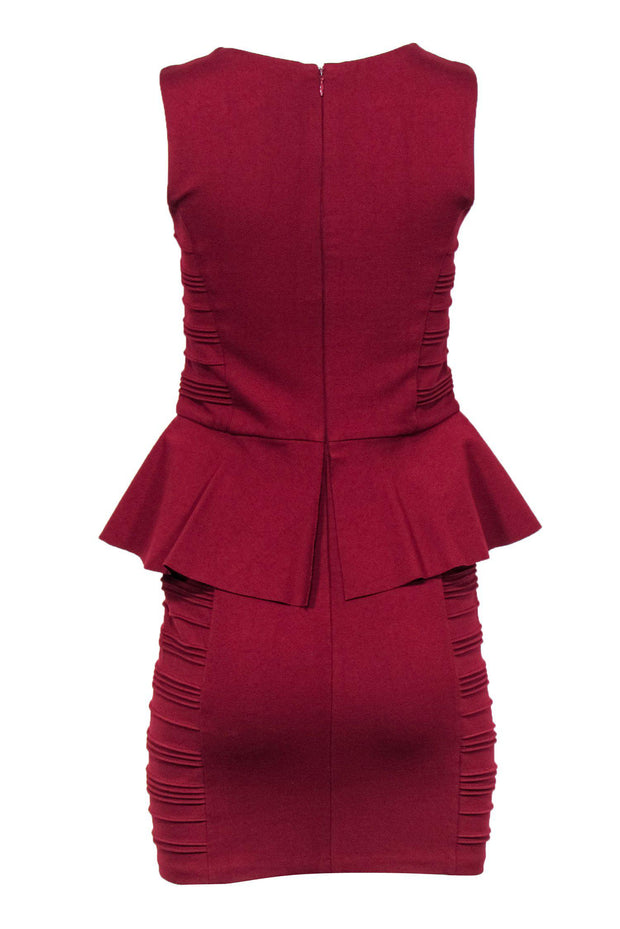 maroon peplum dress Burgundy dress with a peplum design at the waist
